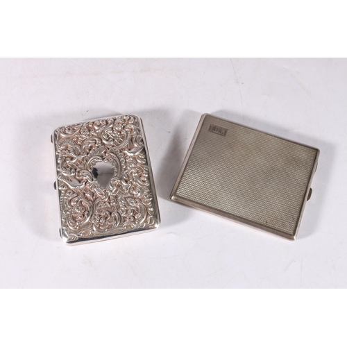 57 - George V silver cigarette case with guilloche work body, initialled T.D.H Birmingham, 1932, 154g and... 