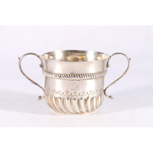 66 - William and Mary period silver porringer or loving cup with twin handles, gadroomed rope band and cr... 