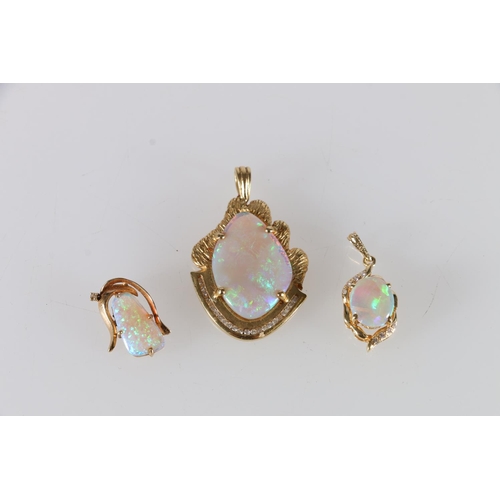 76 - 18ct gold mounted opal and diamond pendant 9.7g, another 3.0g and an unhallmarked yellow metal mount... 