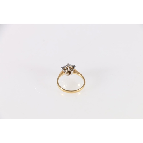 77 - 18ct gold diamond seven stone dress ring, the central diamond approximately 0.15ct encircled by six ... 