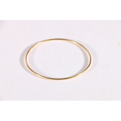 79 - 14k stamped yellow gold hollow bangle, 3.1g