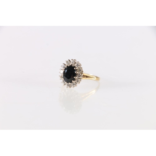 82 - Gold diamond and jet dress ring, the central faceted jet stone encircled by twelve round diamonds, h... 