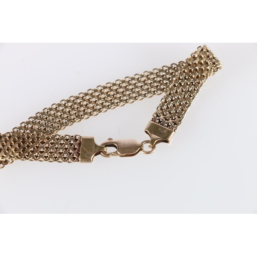 90C - 9ct gold strap bracelet, the terminal and clasp stamped '375' 10.4g.