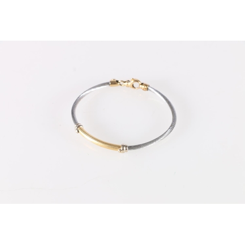 93 - Italian 18ct yellow and white gold bangle with applied lozenge inscribed 'Girotto', probably for Alb... 