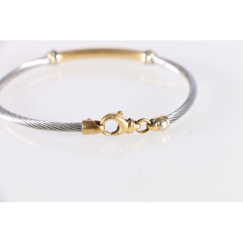 93 - Italian 18ct yellow and white gold bangle with applied lozenge inscribed 'Girotto', probably for Alb... 