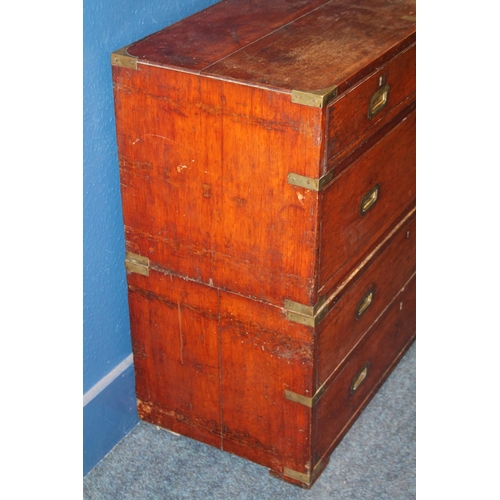 574 - Antique brass bound teak military campaign chest of typical form of two sections having recessed han... 