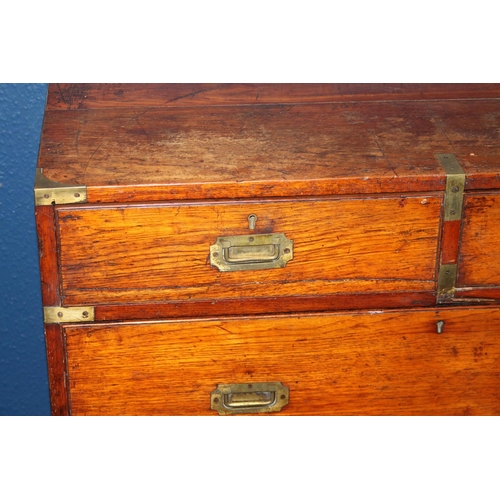 574 - Antique brass bound teak military campaign chest of typical form of two sections having recessed han... 