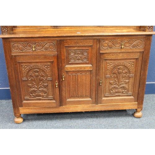 576 - Antique carved oak court cupboard of typical form with Jacobean style profuse carvings depicting thi... 