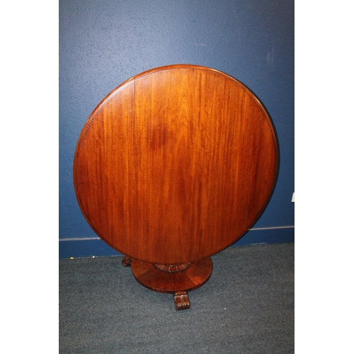 579 - Antique mahogany tilt top breakfast table of circular form raised on column with platform base upon ... 