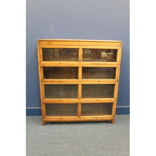 591 - Large oak sectional stacking bookcase in the Globe Wernicke style, 128cm long. 