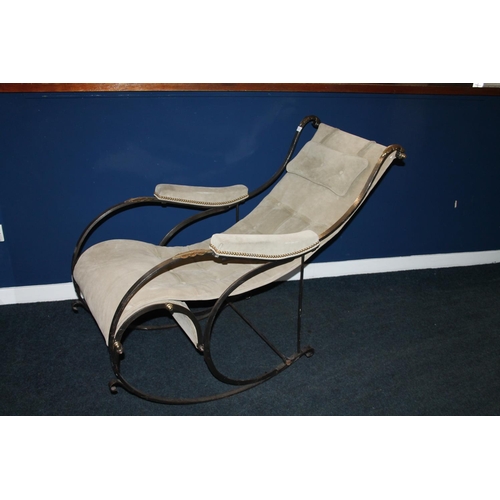 595 - 20th century steel and brass mounted rocking armchair. 