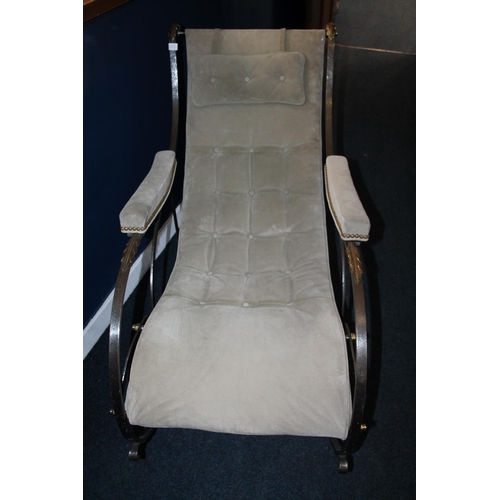 595 - 20th century steel and brass mounted rocking armchair. 