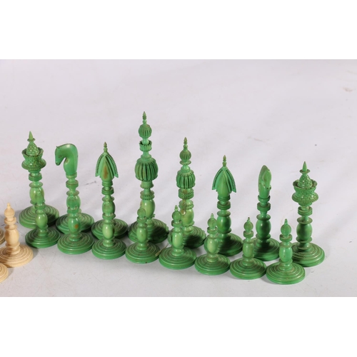 344 - A mid 19th century Indian ivory Pepys style chess set, part stained green, complete and nicely carve... 