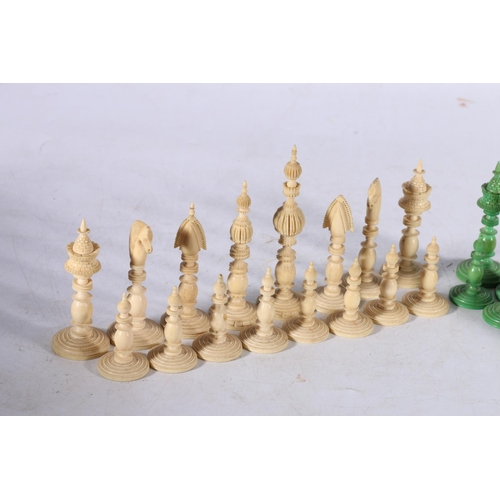 344 - A mid 19th century Indian ivory Pepys style chess set, part stained green, complete and nicely carve... 
