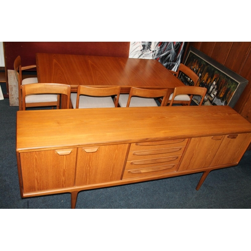 597 - Mid Century teak dining room suite comprising sideboard, table and six (4+2) chairs, sideboard 213cm... 