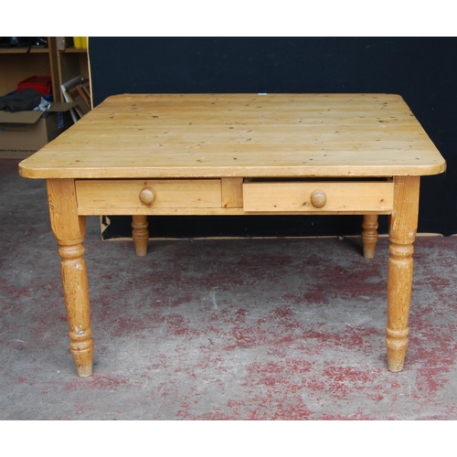 342 - Pine farmhouse table of square form with canted corners with two cutlery drawers to each end, on tur... 
