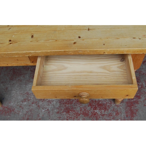 342 - Pine farmhouse table of square form with canted corners with two cutlery drawers to each end, on tur... 