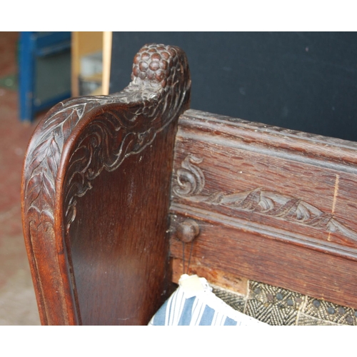 359 - 19th century continental carved oak hall bench decorated with carved floral, fruit, vine and acanthu... 