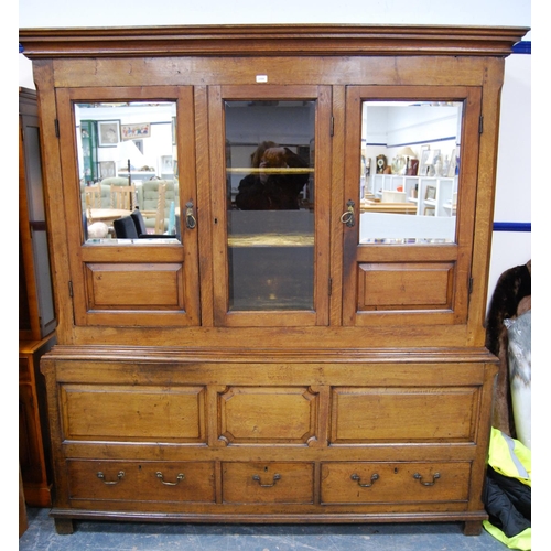 375 - George III oak cabinet on dower chest (formerly a livery cupboard), the glazed door enclosing velour... 