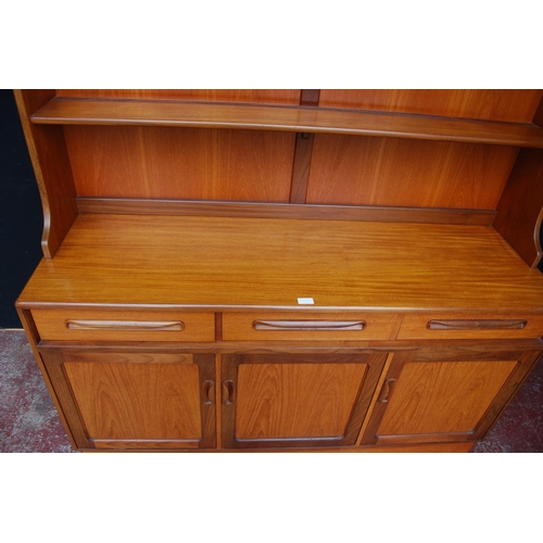 378 - Mid-20th century G Plan teak dresser, the detachable top with open shelving above three short drawer... 