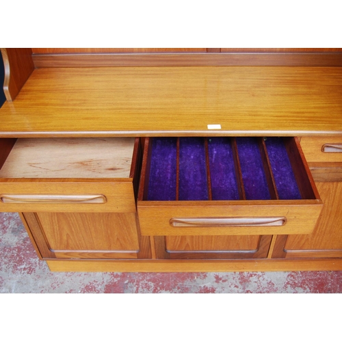 378 - Mid-20th century G Plan teak dresser, the detachable top with open shelving above three short drawer... 