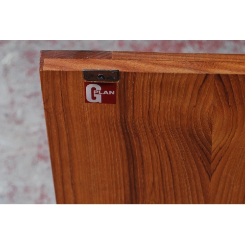 378 - Mid-20th century G Plan teak dresser, the detachable top with open shelving above three short drawer... 