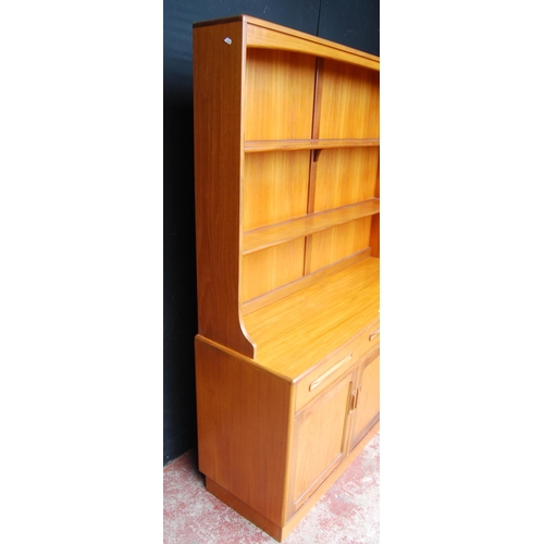 378 - Mid-20th century G Plan teak dresser, the detachable top with open shelving above three short drawer... 