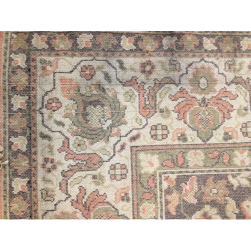 601 - Large wool rug, orange field decorated with hunting scenes with Arab figures on horseback chasing bi... 