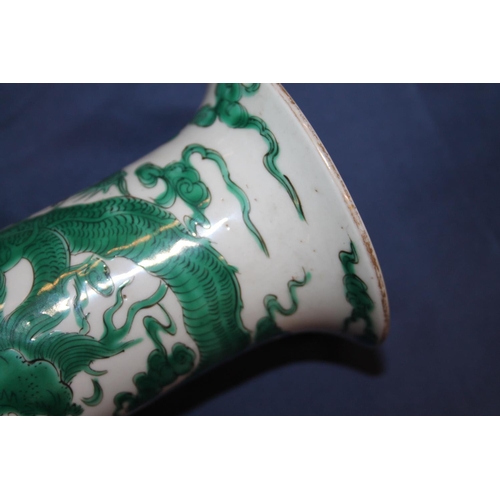 368 - 19th century Chinese column vase decorated in green enamel with an encircling dragon amongst clouds,... 