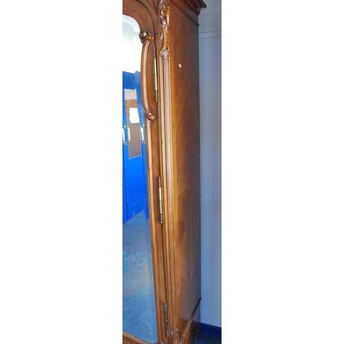 370 - French walnut armoire, with a detachable surmount above a shaped cornice decorated with floral round... 