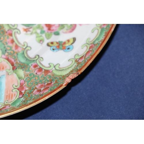 373 - A pair of 19th century Canton famille rose dishes decorated with four panels of figures, flowers, bi... 