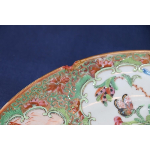 373 - A pair of 19th century Canton famille rose dishes decorated with four panels of figures, flowers, bi... 