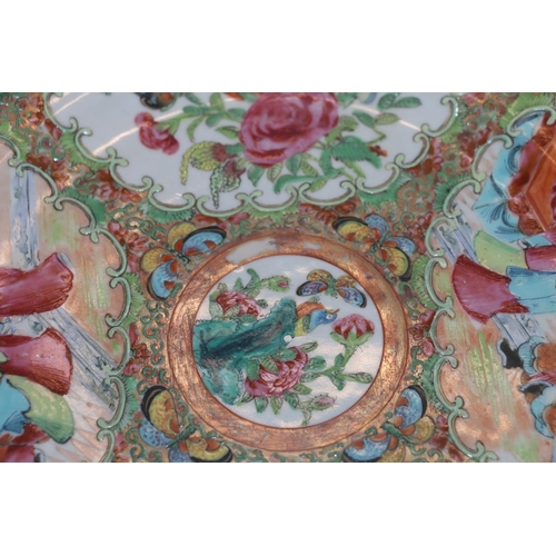 373 - A pair of 19th century Canton famille rose dishes decorated with four panels of figures, flowers, bi... 