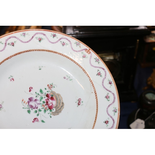 378 - Four 18th century Chinese porcelain dishes, a pair decorated in famille rose colours with wavy folia... 