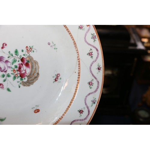 378 - Four 18th century Chinese porcelain dishes, a pair decorated in famille rose colours with wavy folia... 