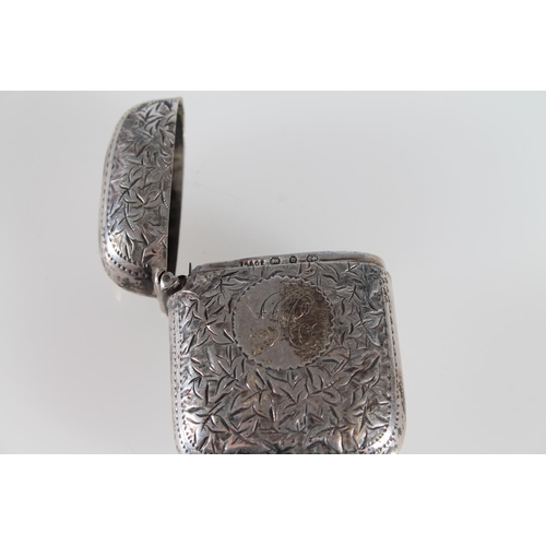 482 - Sterling silver vesta case with all over foliate decoration, Birmingham, maker TA and Co, 29.2g