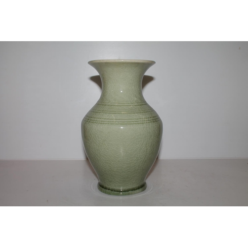 54 - Oriental Chinese, or Japanese, celadon glazed baluster vase with incised signature to the base, 24cm... 