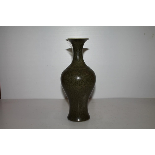 56 - Oriental Chinese, or Japanese, sage green bottle vase with signature to the base, 26cm tall.  (a/f)