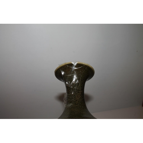 56 - Oriental Chinese, or Japanese, sage green bottle vase with signature to the base, 26cm tall.  (a/f)