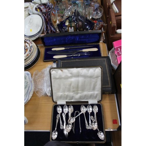 236 - Boxed flatware to include a carving set, teaspoons and tongs, etc.