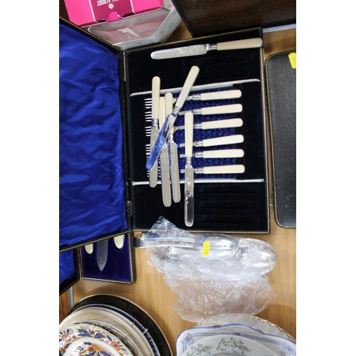 236 - Boxed flatware to include a carving set, teaspoons and tongs, etc.