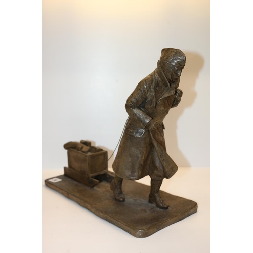 36 - Modern sculpture of a man pulling a ammunition cart, signed D Taylor and dated base, 37cm long.