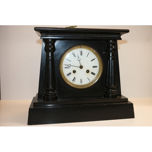 47 - Black marble mantle clock, the movement striking on a bell, stamped 'Gve Rey Jnr Brevete .... Marti'... 