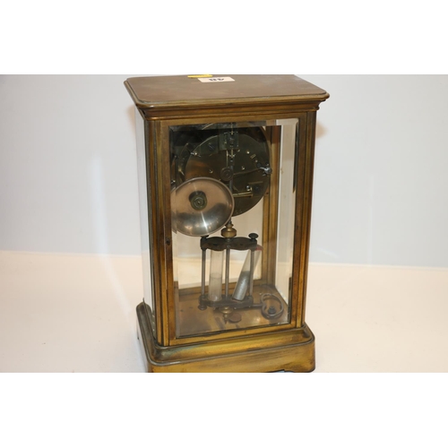 48 - French brass four glass mantel clock with visible anchor escapement, 28cm tall. 