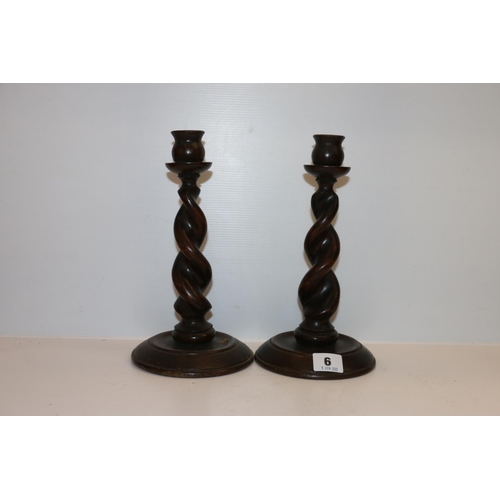 6 - Pair of oak barley twist candlesticks, 26cm tall. 