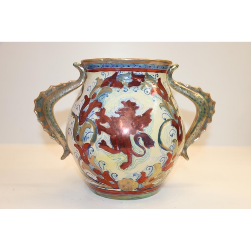 75 - Pottery twin-handled jug with lustre decoration.