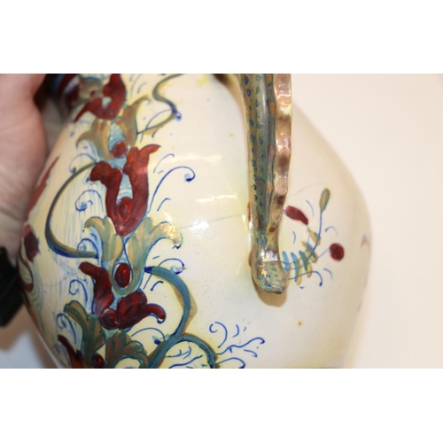 75 - Pottery twin-handled jug with lustre decoration.