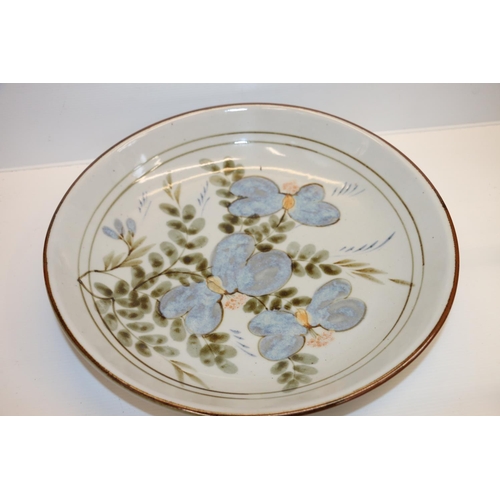 84 - Highland Stoneware pottery charger dish decorated with floral pattern, 35cm diameter. 