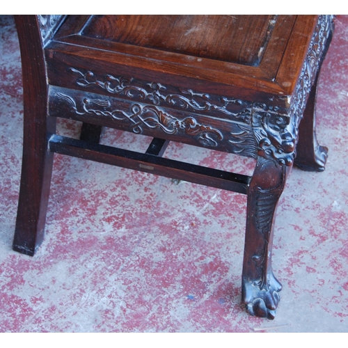 381 - Chinese Qing carved hongmu chair carved profusely with dragons, flaming pearl and scrolls to the bac... 