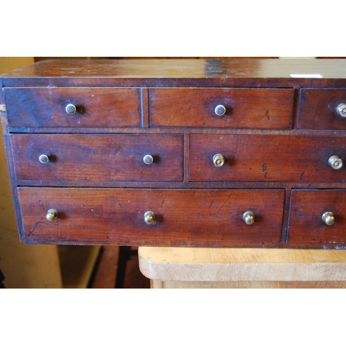 383 - Set of George III mahogany collector's drawers with eleven assorted deep drawers, 25cm high, 92cm wi... 